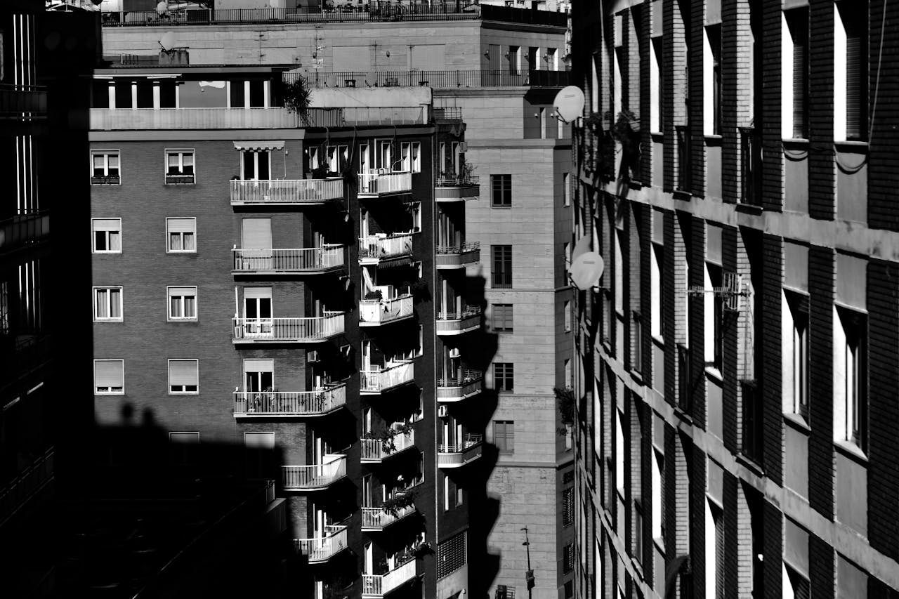 Grayscale Photo of Apartment Buildings